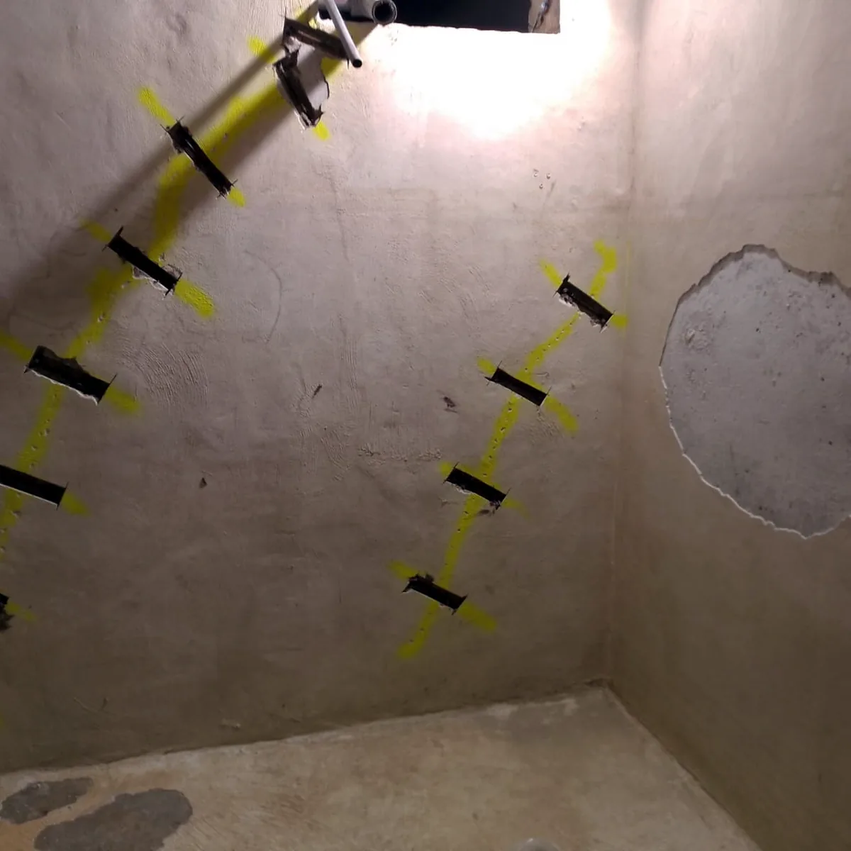 Cracks marked with tape before the water tank lining in Palma