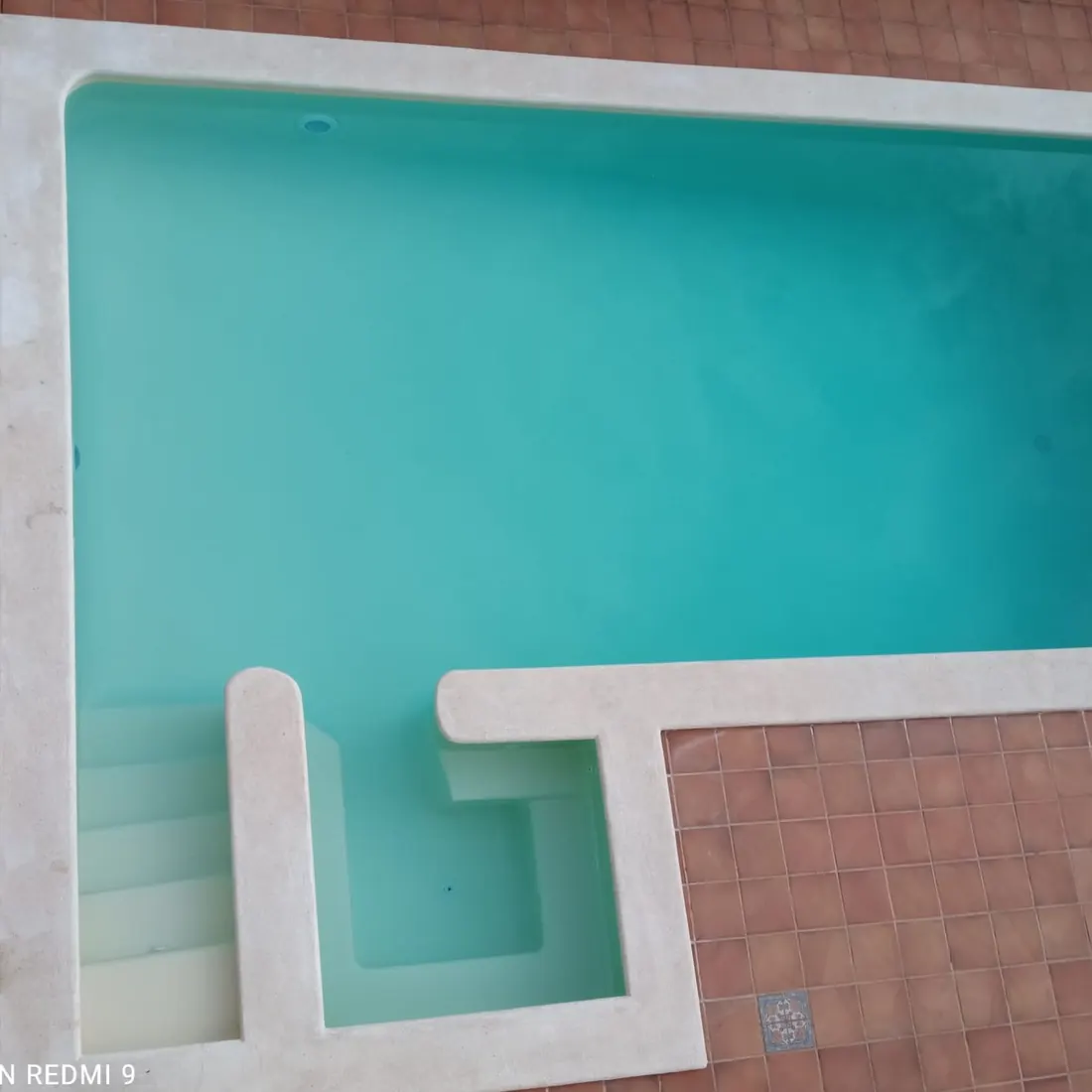 The pool from above, showing the shallow step bay The pool from above, showing the shallow step bay