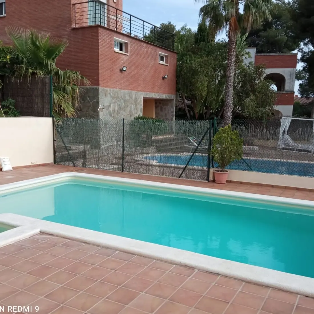 Steps into the private pool, with the house behind Steps into the private pool, with the house behind