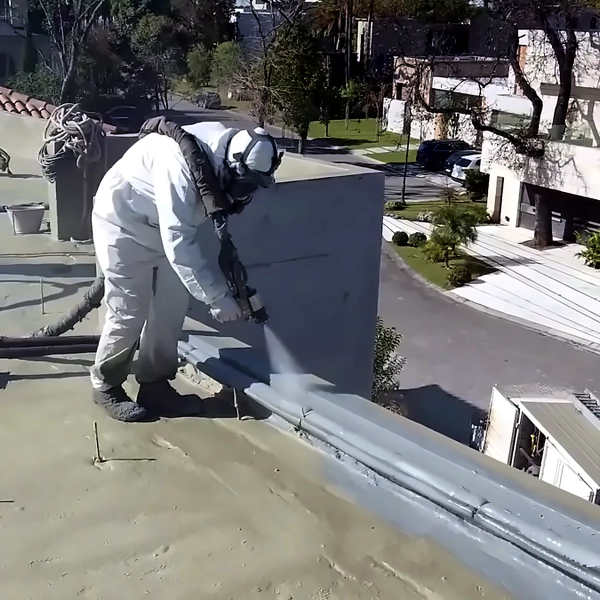 Polyurea membrane sprayed along the roof parapet of a house in San Isidro, Argentina Polyurea membrane sprayed along the roof parapet of a house in San Isidro, Argentina