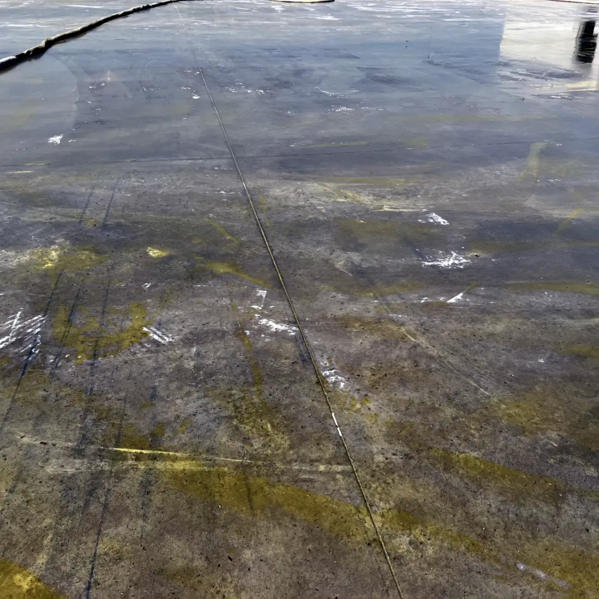 Concrete roof deck with yellowish patches before the grey coat, La Línea