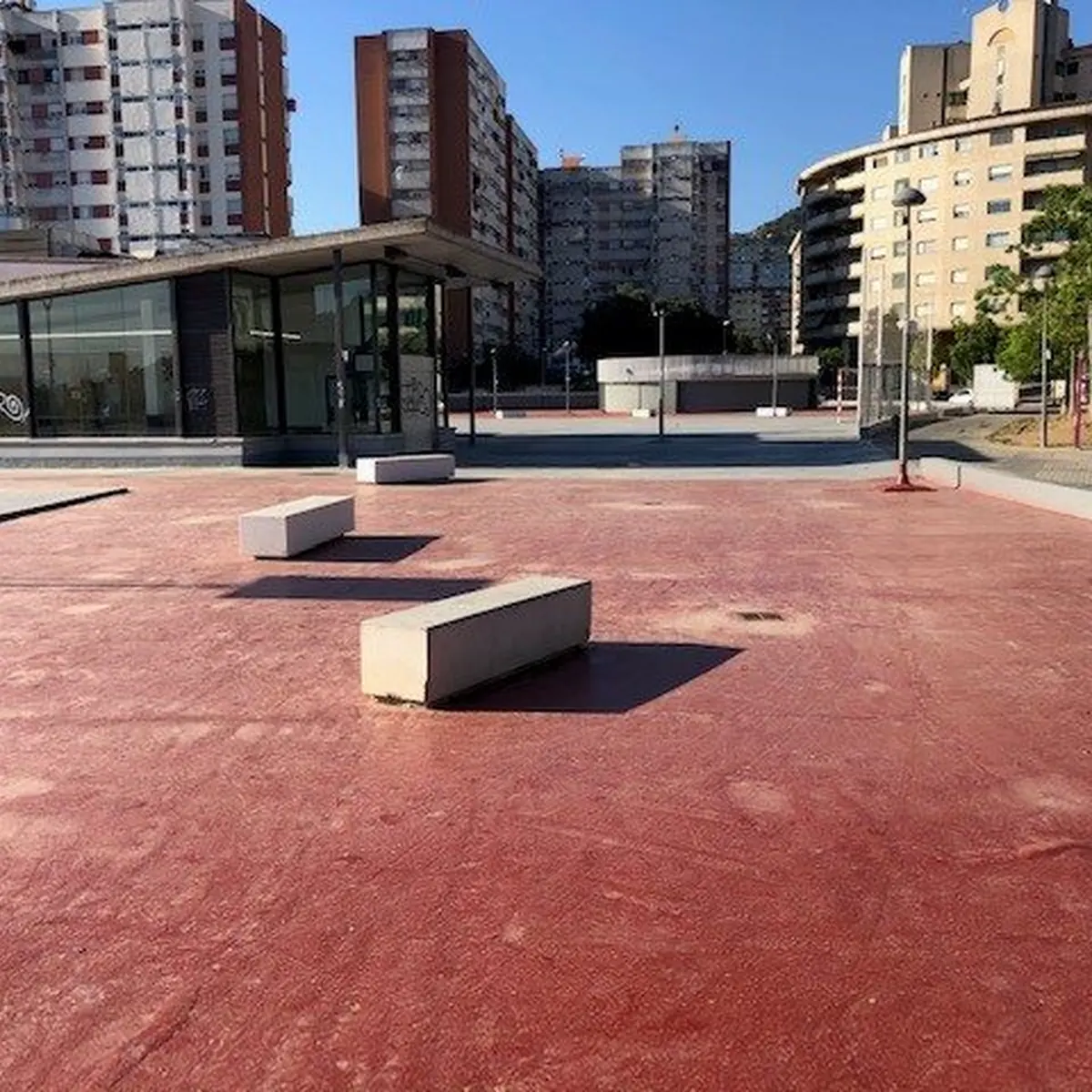 Red area with concrete benches on the rooftop sports space, Barcelona