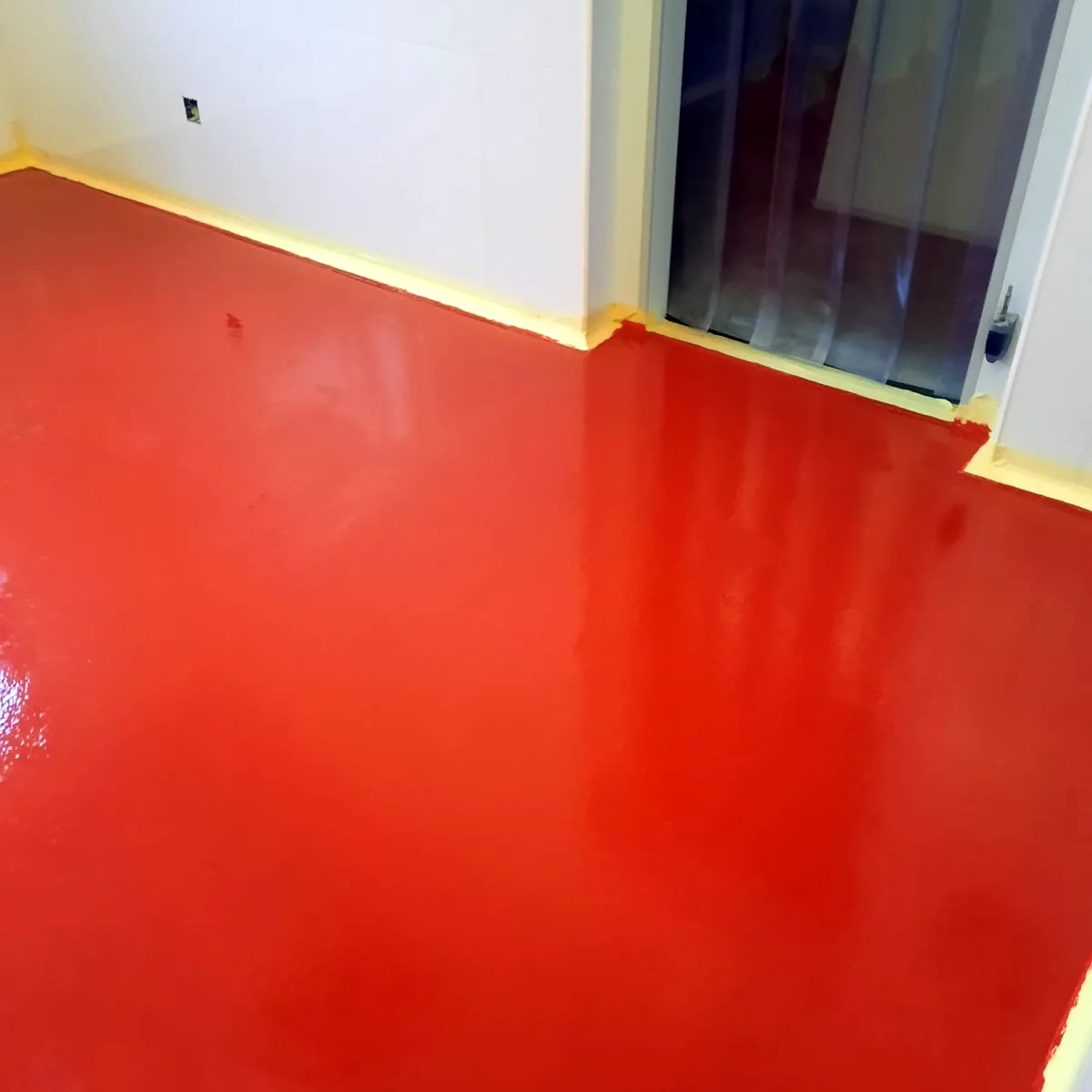 Red finish running up to a strip curtain door Red finish running up to a strip curtain door