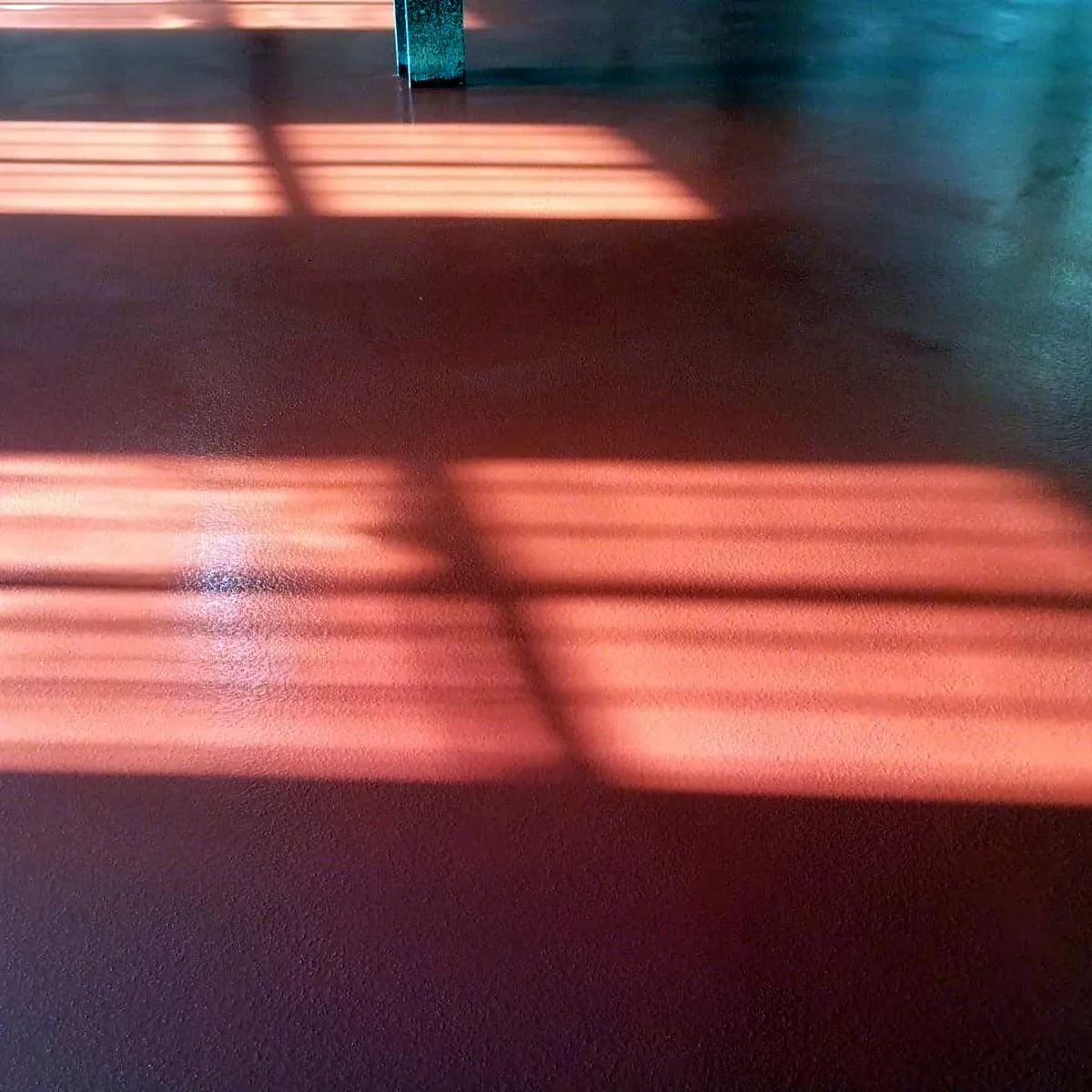 Red polyurethane floor with window light falling across it, Sant Pere de Casserres Red polyurethane floor with window light falling across it, Sant Pere de Casserres
