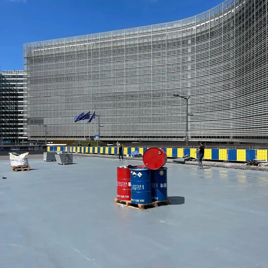 The grey coated surface in front of the glazed building