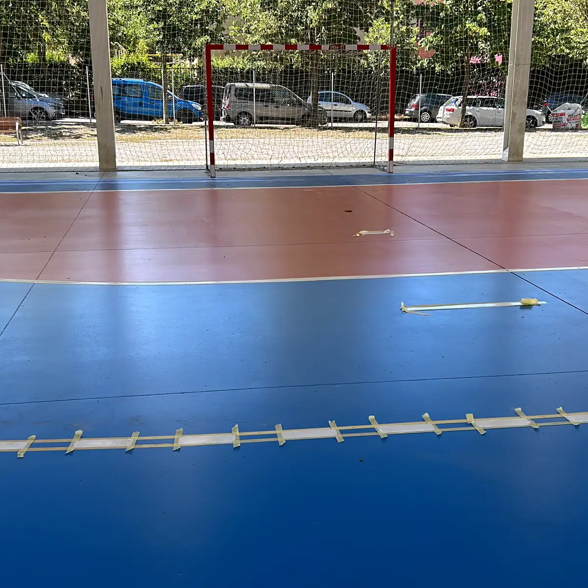 Sports pavilion flooring in Granollers with the goal behind the zone