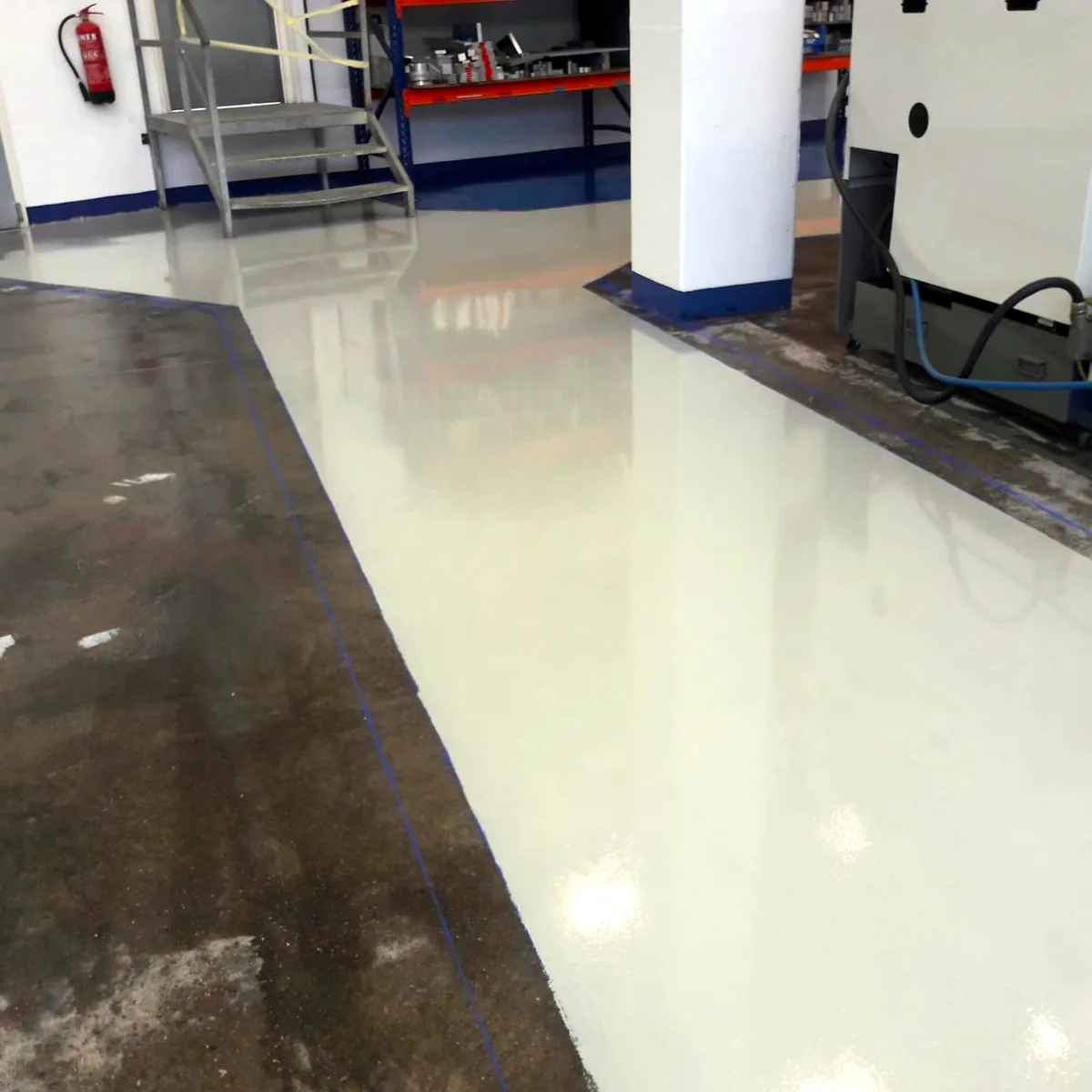 New light grey aisle next to the untreated slab, Gurb