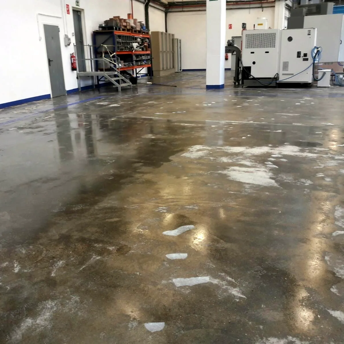 Worn concrete floor in the plant before the works, Gurb