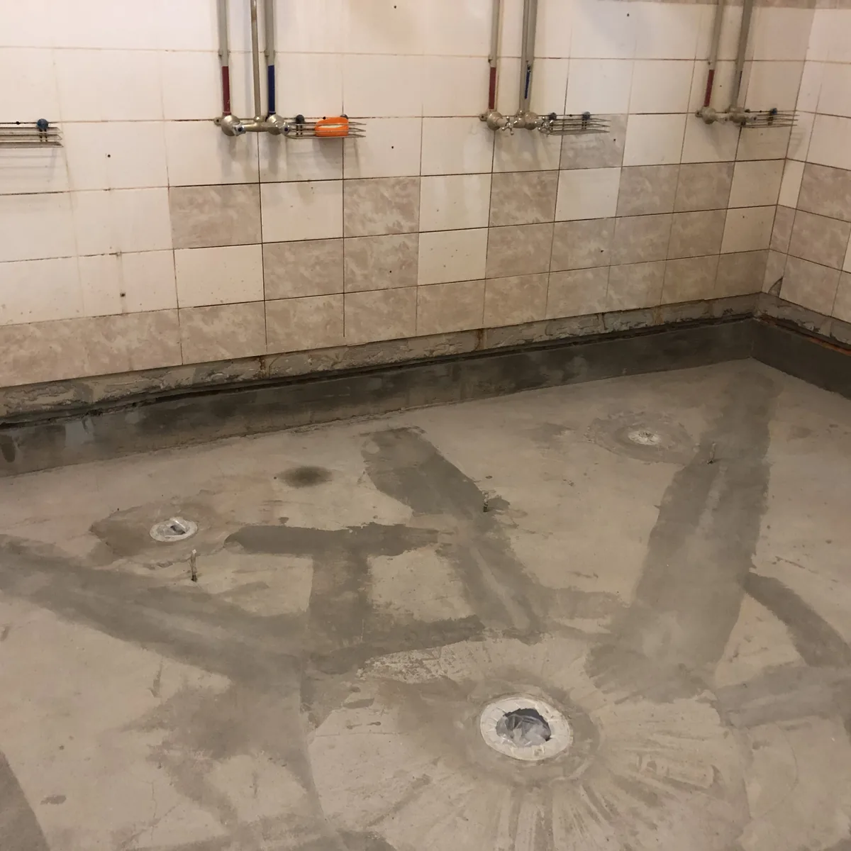Floor cracks radiating around a pool drain before repair, Russia