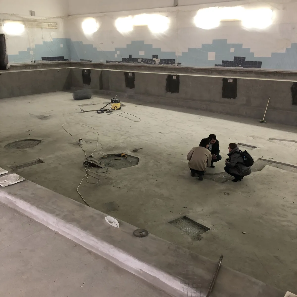 Two workers preparing the pool floor, Nizhny Novgorod