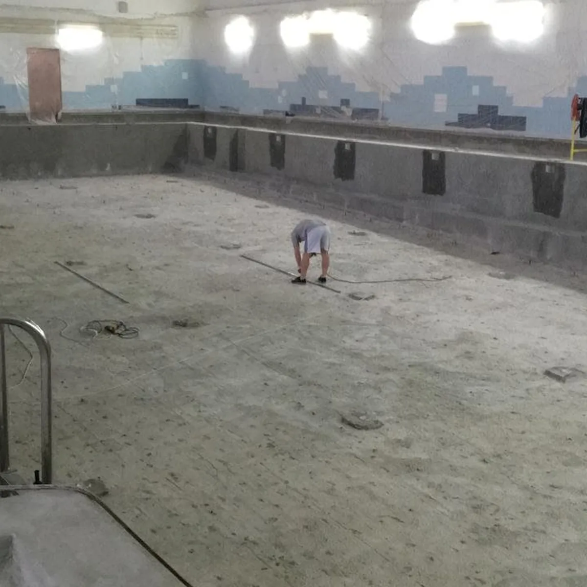 Empty pool basin with worn concrete before waterproofing, Nizhny Novgorod