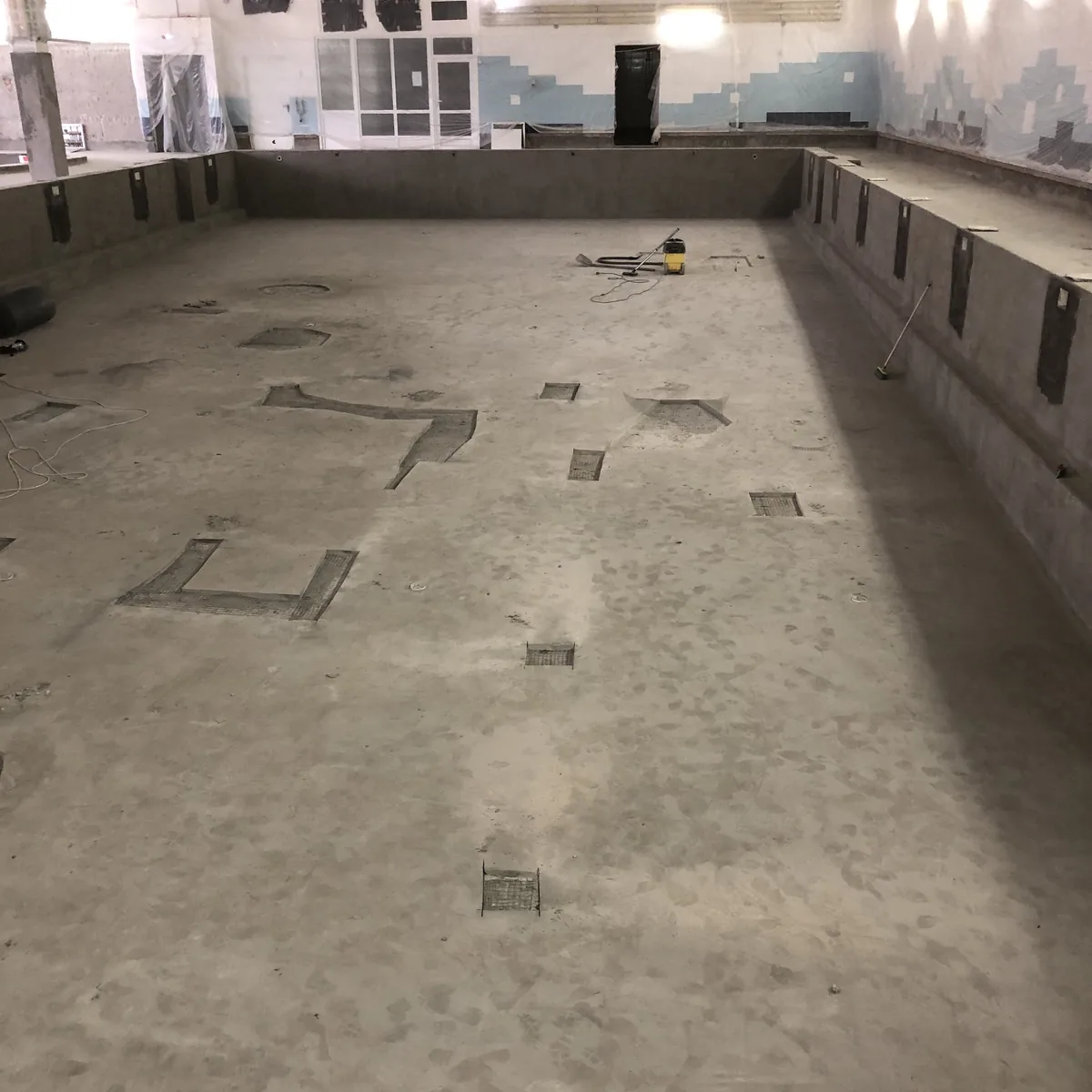 Patched areas on the long pool floor before coating, Nizhny Novgorod