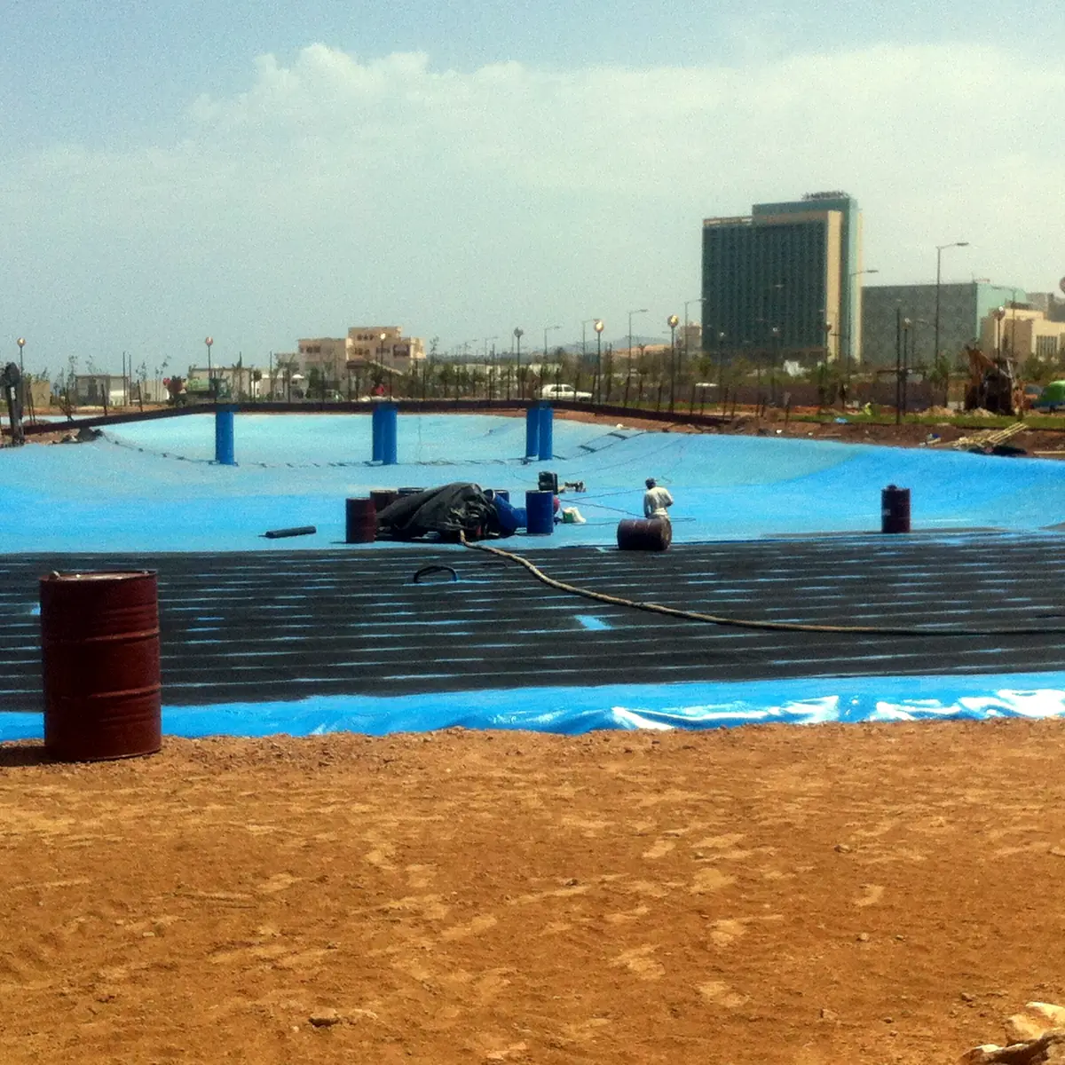 Blue lake liner with high-rise buildings on the skyline