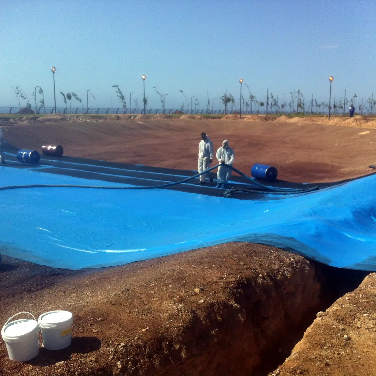 Blue urban lake lining running down the slope in Algeria