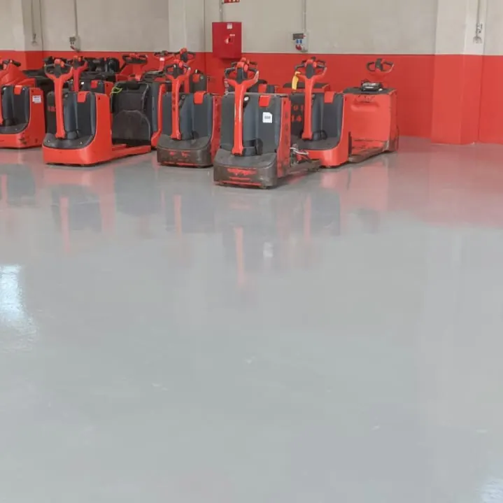 Red pallet trucks on the finished floor
