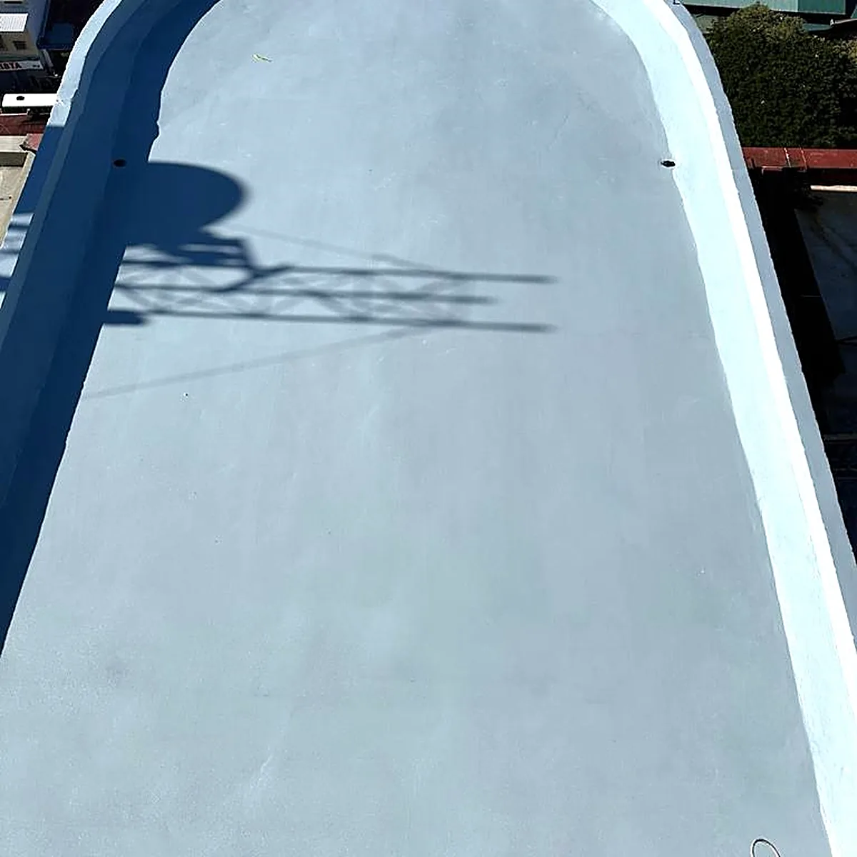 Curved end of the roof with a blue edge band Curved end of the roof with a blue edge band