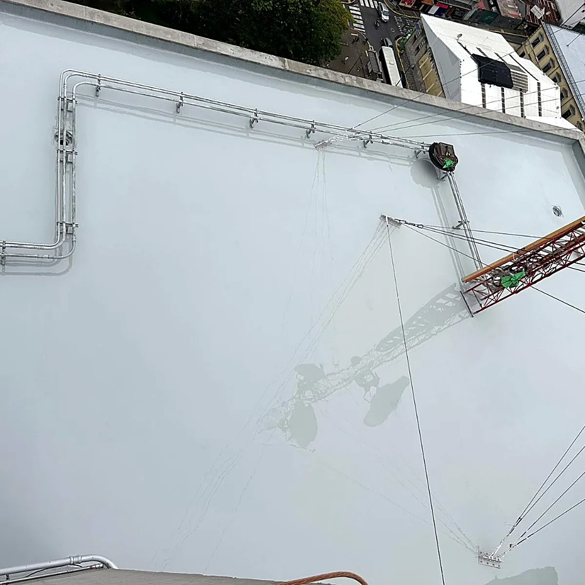 Stepped roof area from above with the grey coat and a mast Stepped roof area from above with the grey coat and a mast