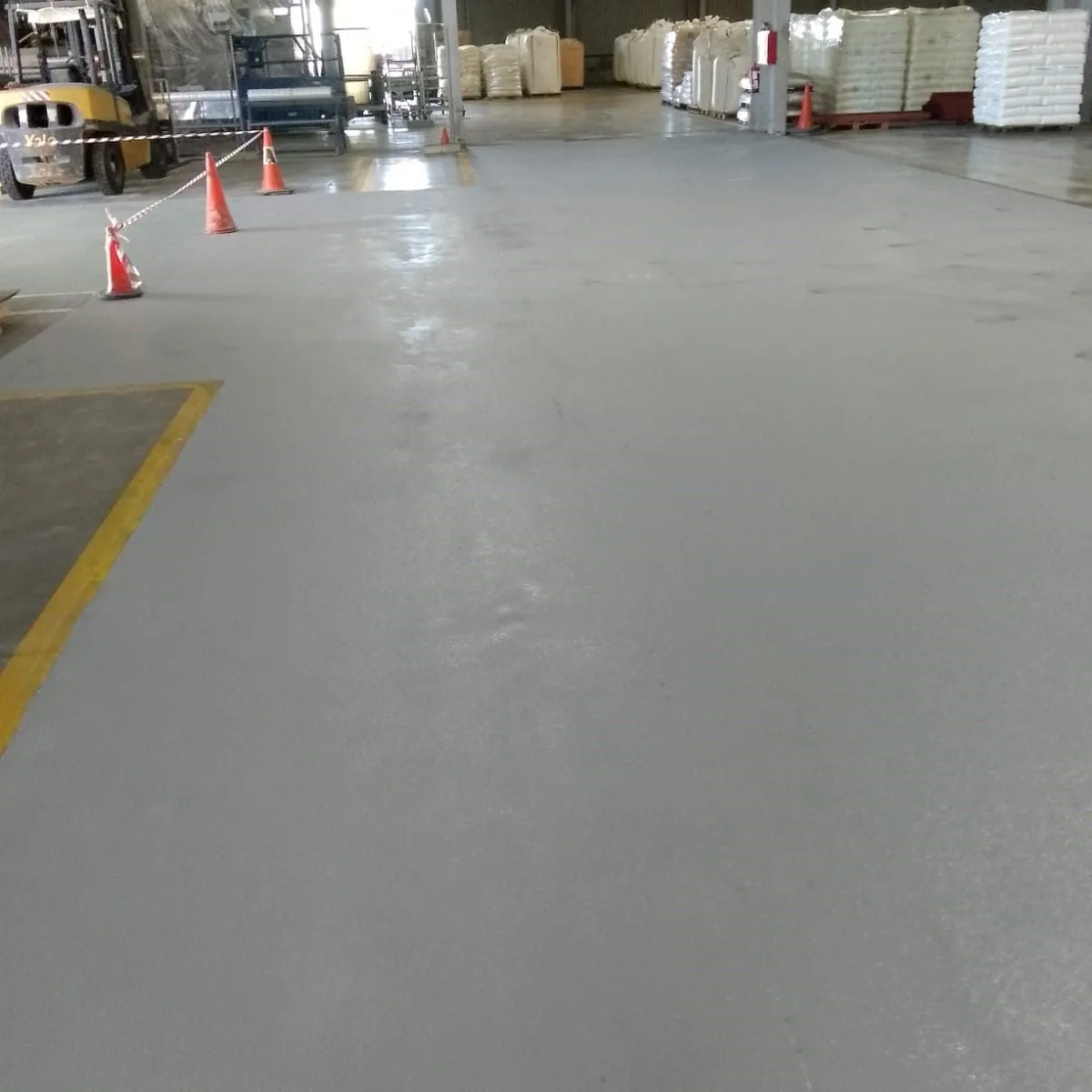 Work zone marked with cones in the warehouse, Constantí