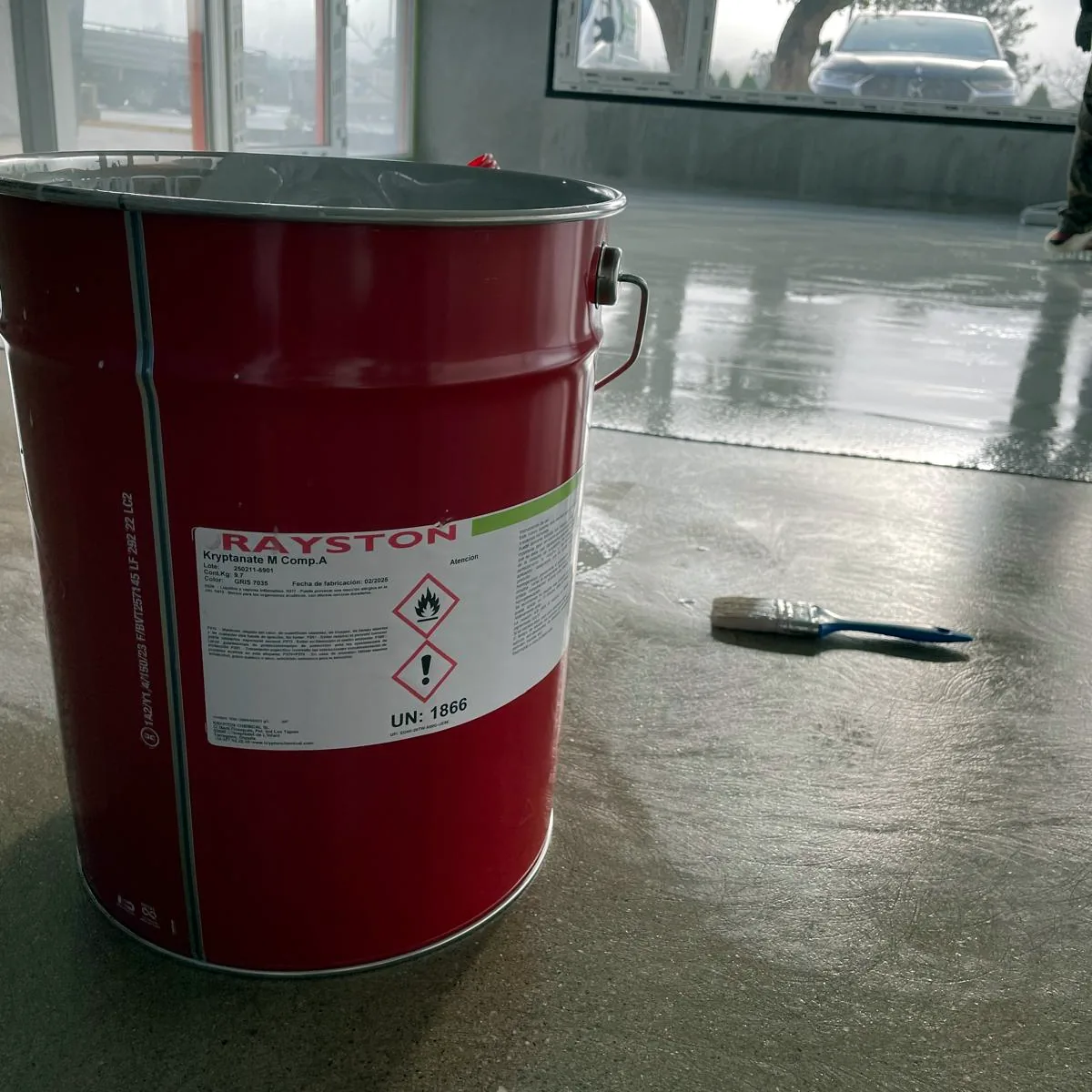 Product tin and brush set down near the windows