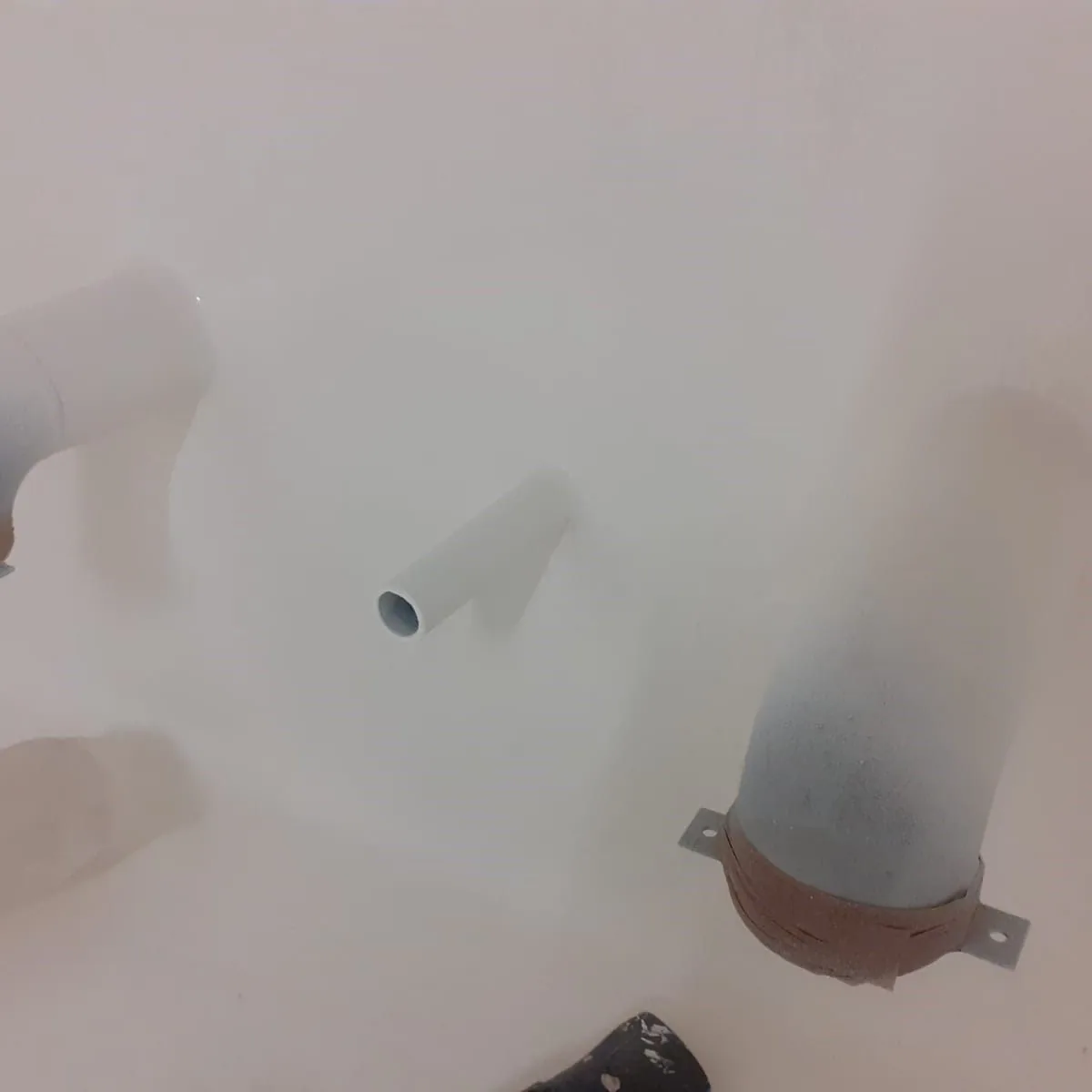 Lined wall with pipe outlets, Mallorca